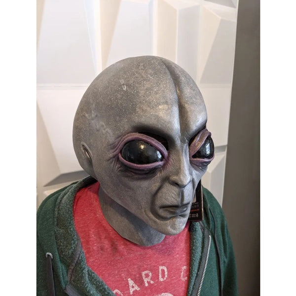 This unique Alien Mask Latex Headgear is sure to make a statement at your next Halloween celebration! Expertly crafted from silicone for maximum durability, it features intricate detailing for a realistic look and feel. Enjoy superior comfort and style, knowing you have the most eye-catching costume in the room.
