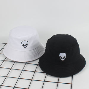 This comfortable and stylish bucket hat is perfect for outdoor activities. It's made of breathable cotton, and features an eye-catching embroidered alien symbol. A wide brim provides all-day protection from the sun, while also delivering a fashionable element to any look. The lightweight hat is perfect for anyone who puts a premium on both style and comfort. black and white
